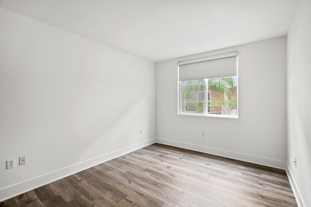 Bedroom with Vinyl Flooring and Window