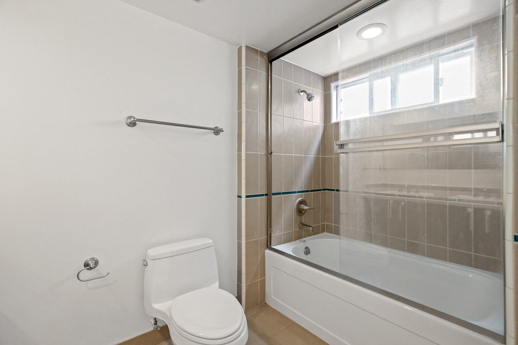 Bathroom with a Full-Size Bathtub with Glass Doors