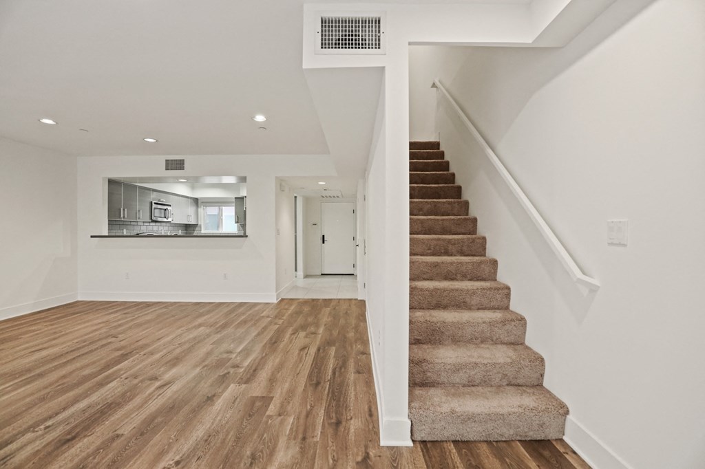 Kitchen & Dining Rooms with Staircase to Second Level