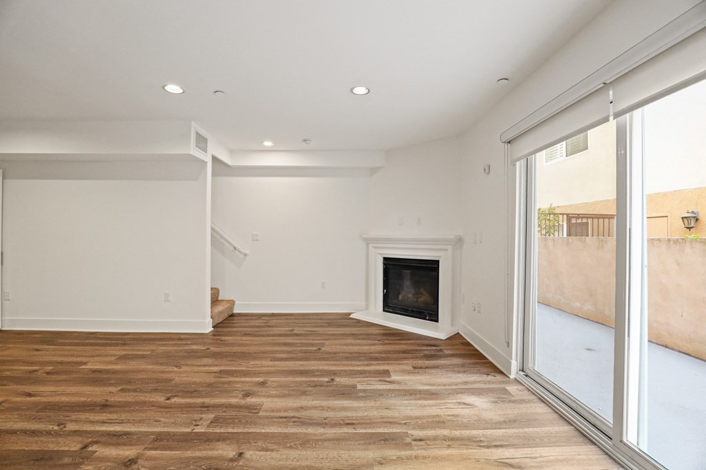 Living Room with Electric Fireplace and Spacious Patio