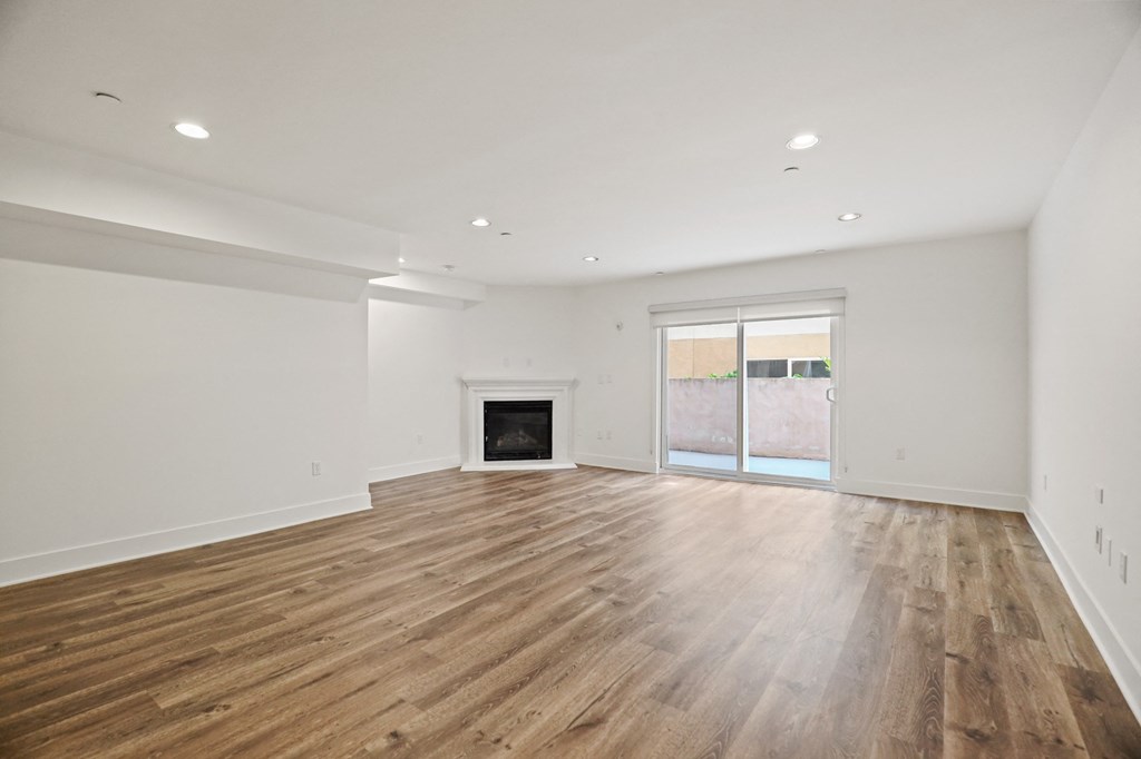 Open-Concept Dining and Living Room with an Electric Fireplace