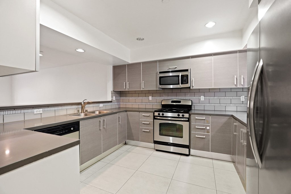 Spacious Kitchen with Energy-Efficient  Appliances and Ample Cabinet Storage