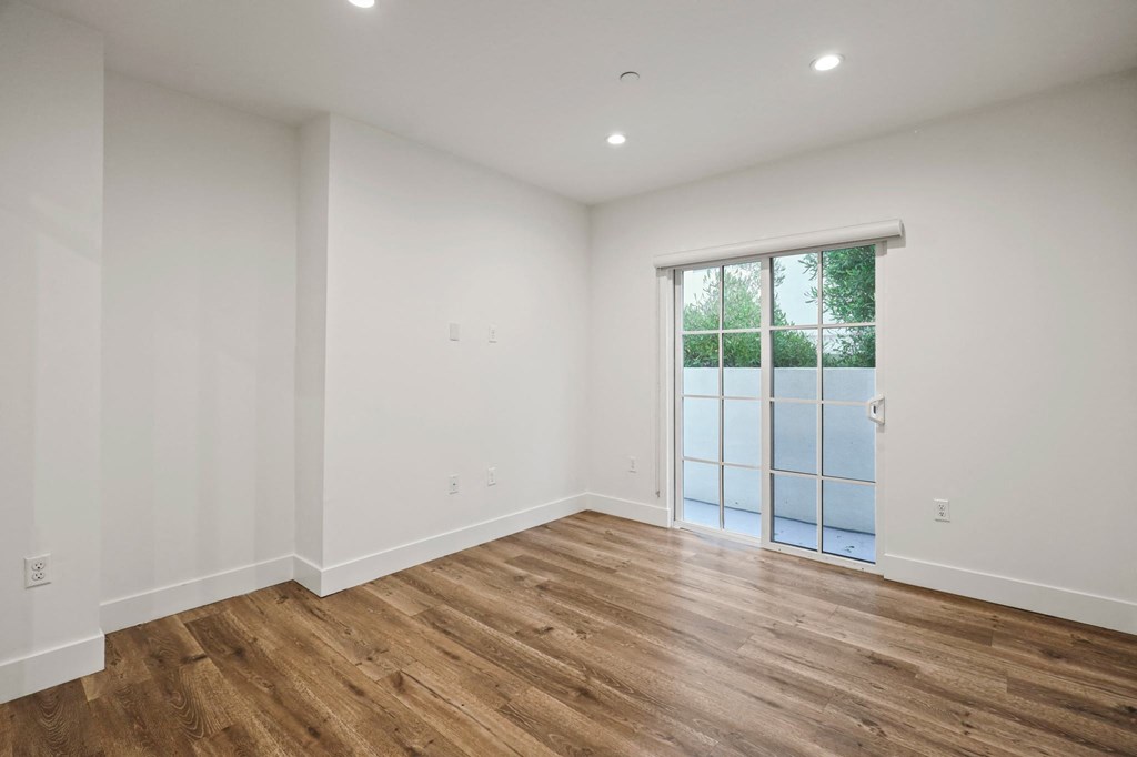 Living Room with Recessed Lighting, Vinyl Flooring, and Patio
