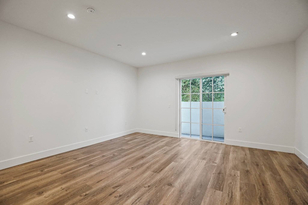 Living Room with Recessed Lighting, Vinyl Flooring, and Patio