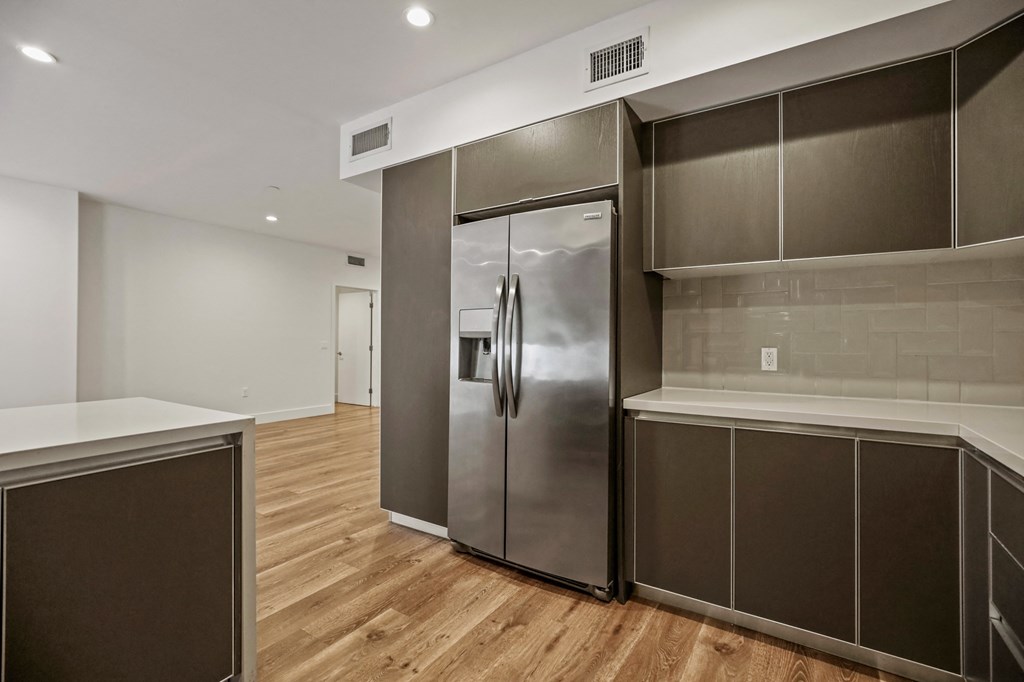 Kitchen with Energy-Efficient Refrigerator and Cabinet Storage