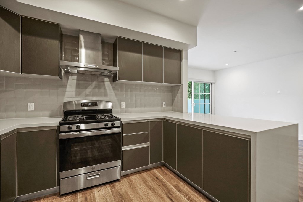 Kitchen with Stainless-Steel Stove and Microwave Oven