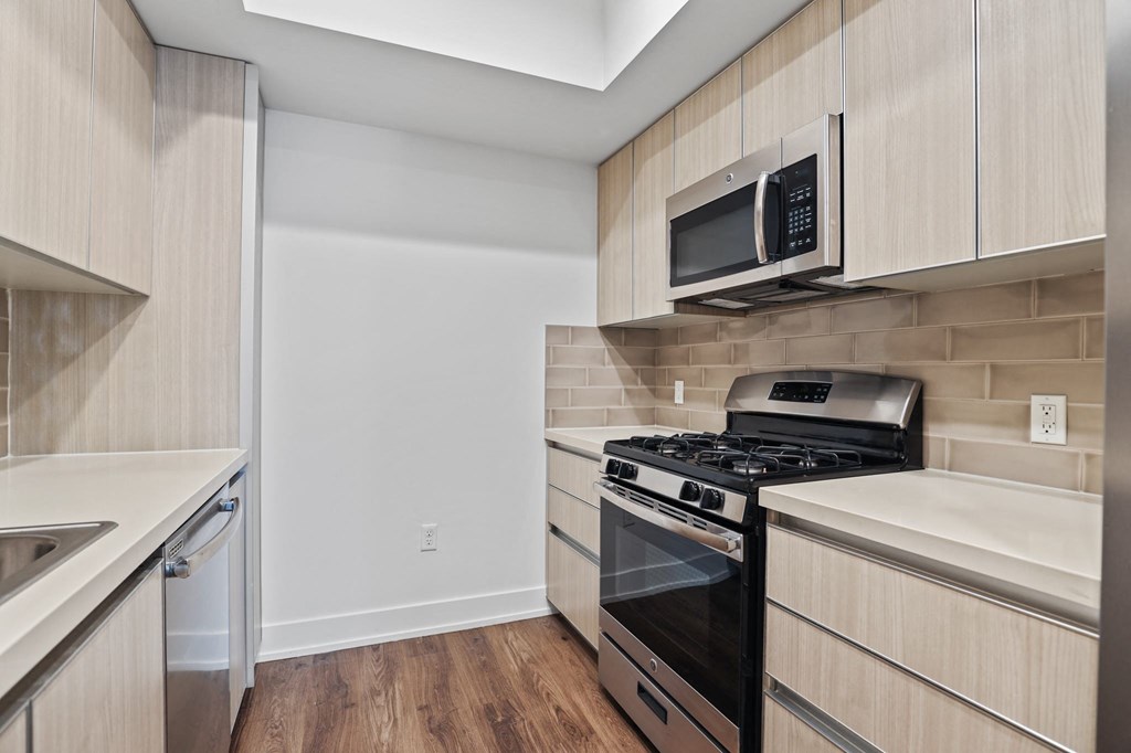 Kitchen with Stainless Steel Stove, Microwave Oven, and Dishwasher