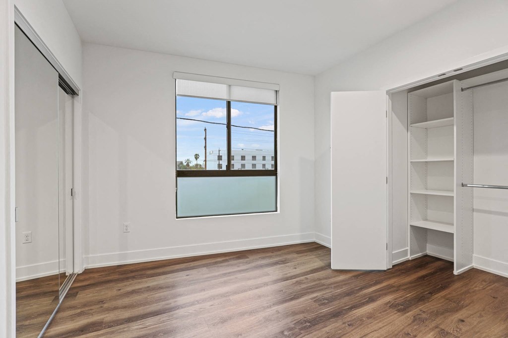 Bedroom with Two Closets and Windows