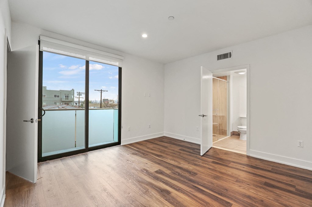Bedroom with Bathroom, Closet, and Balcony