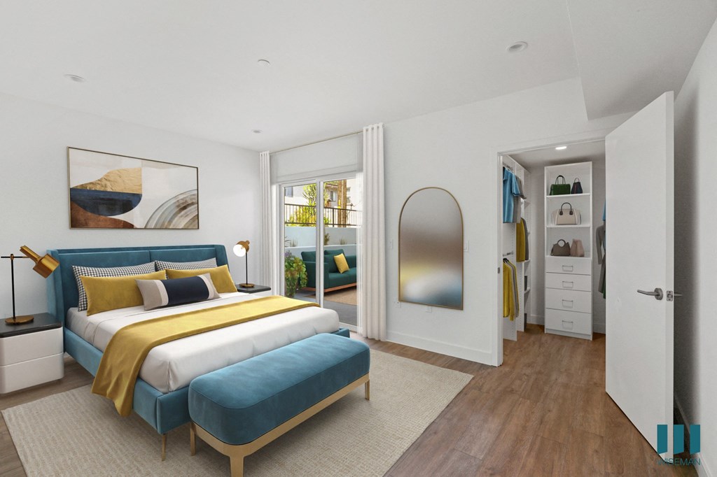 Bedroom with Walk-In Closet with Built-In Organizers and Patio Access