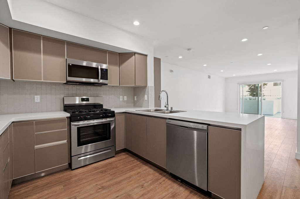 Open-Concept Kitchen with Energy-Efficient Appliances and Countertop Bar