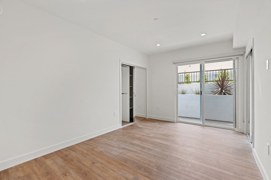 Bedroom with Two Closets with Built-In Shelving