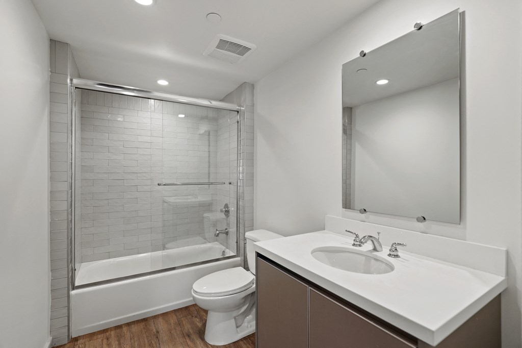 Bathroom with Shower Bath with Glass Door, and Vanity Cabinet Storage