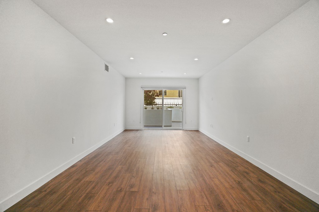 Living Room with Vinyl Flooring, Recessed Lighting, and Patio