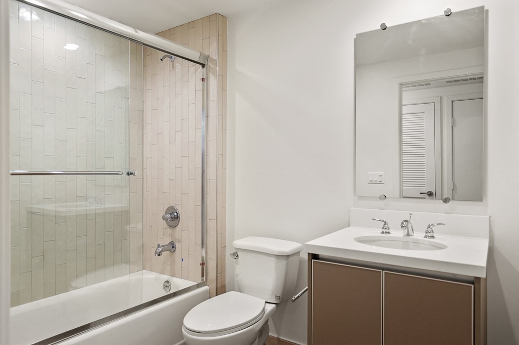 Bathroom with Vanity Cabinet Storage and Shower Bath