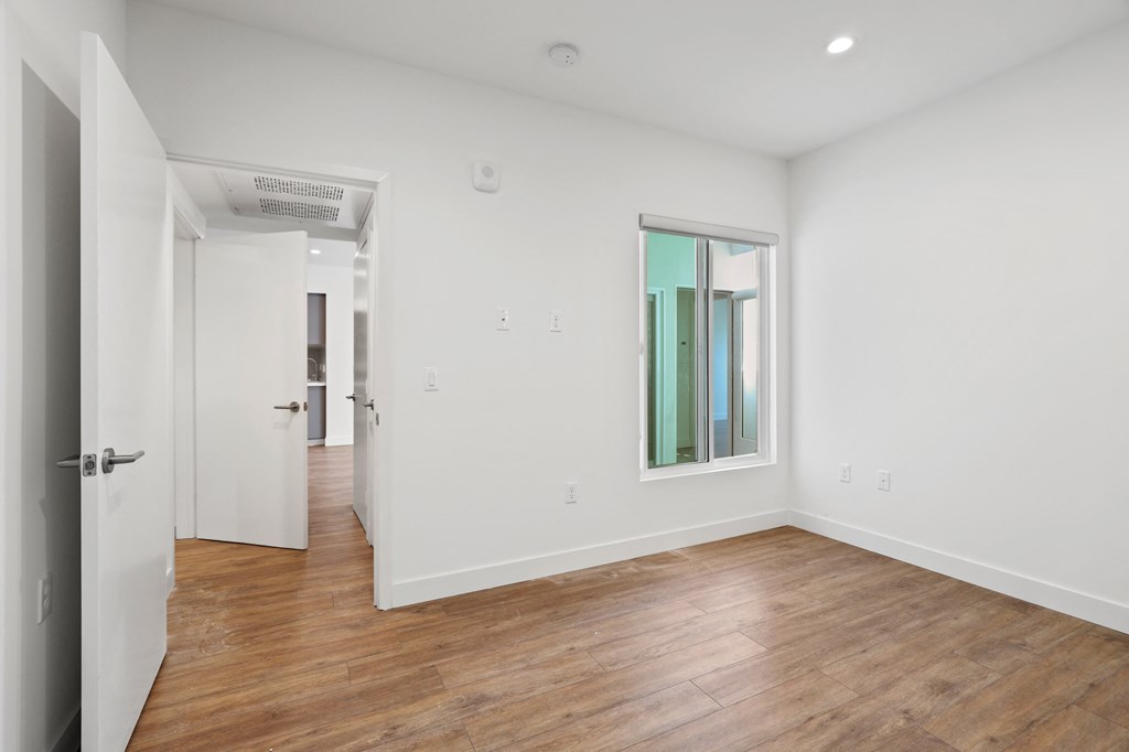 Bedroom with Vinyl Flooring, Recessed Lighting, and Window