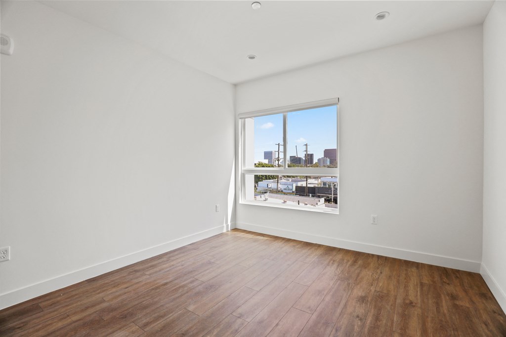 Bedroom with Windows and Vinyl Flooring