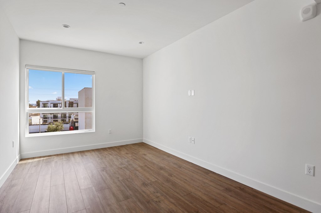 Bedroom with large Windows, Recessed Lighting, and Vinyl Flooring