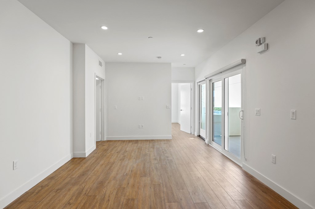 Living Room with Vinyl Flooring, Recessed Lighting, and Patio