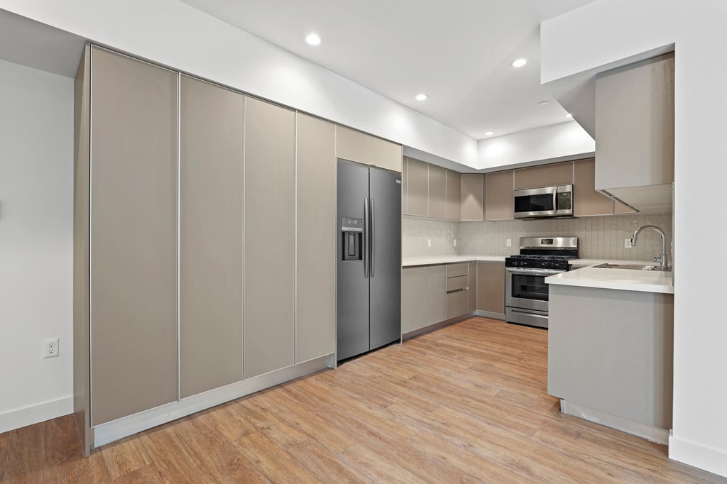 Kitchen with Energy-Efficient Refrigerator, Stove, Microwave Oven, and Dishwasher