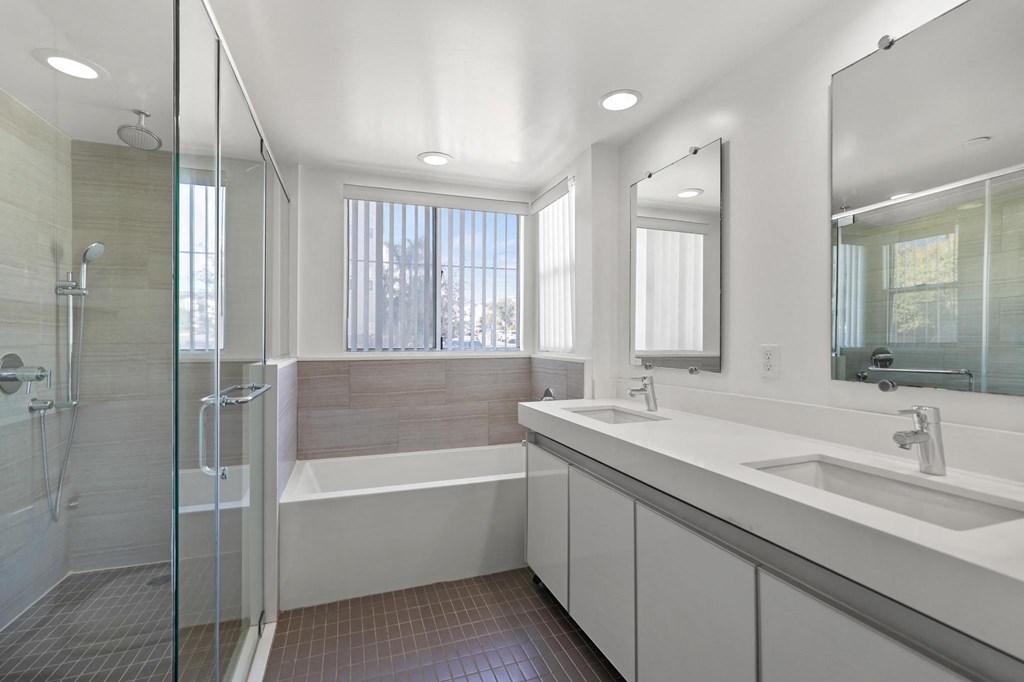 Bathroom with Double-Sink Vanity, Bathtub, and Stand-Up Shower