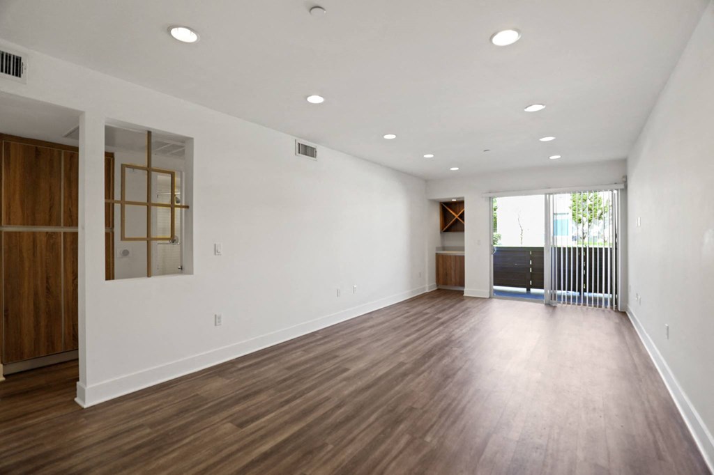 Open-Concept Dining and Living Room Space with Patio