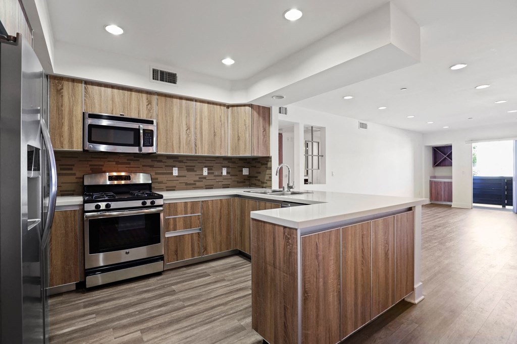 Open-Concept Kitchen with Energy-Efficient Appliances and Ample Cabinet Storage