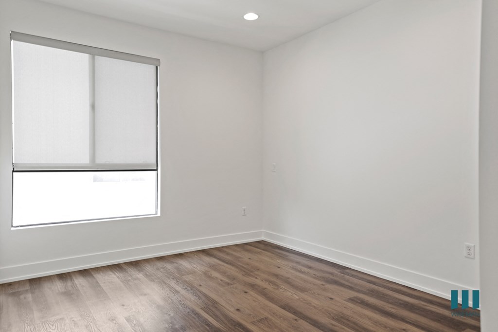 Bedroom with Vinyl Flooring, Recessed Lighting, and Large Windows