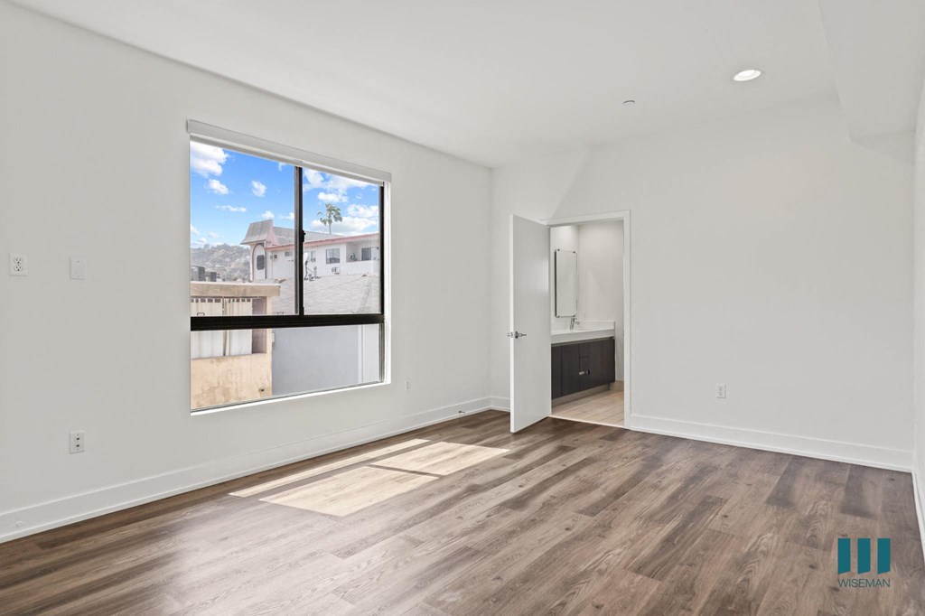 Spacious Bedroom with Bathroom and Windows