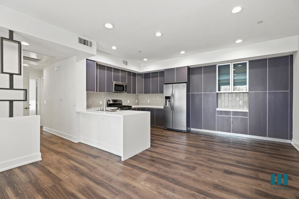 Spacious Kitchen and Dining Area with Ample Cabinet Storage