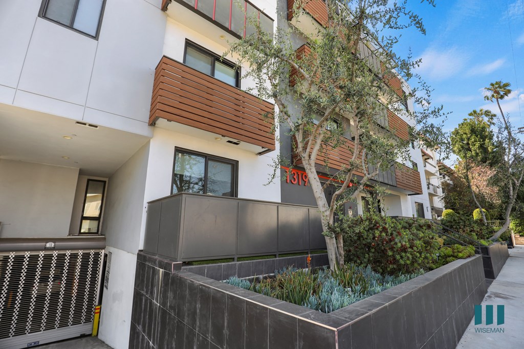 Sidewalk View of Martel Flats by Wiseman