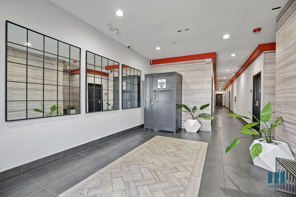 Lobby Area with Resident Package Locker and Elevator