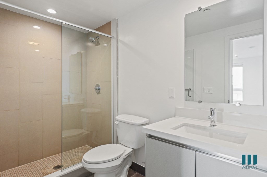 Bathroom with Walk-In Shower and Vanity Cabinet Storage