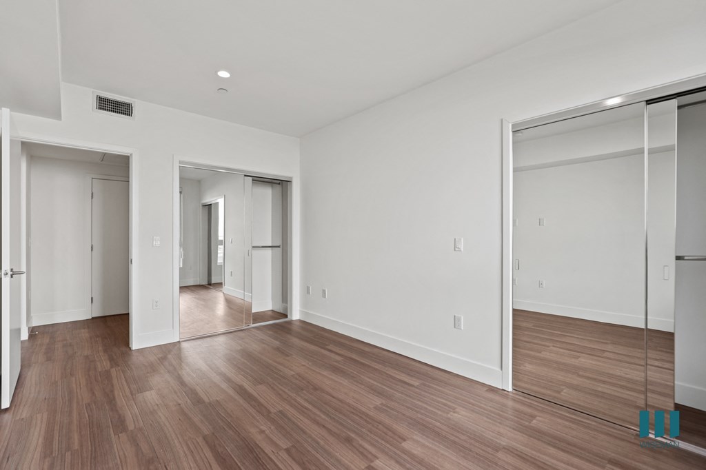 Bedroom with Two Mirrored Closets