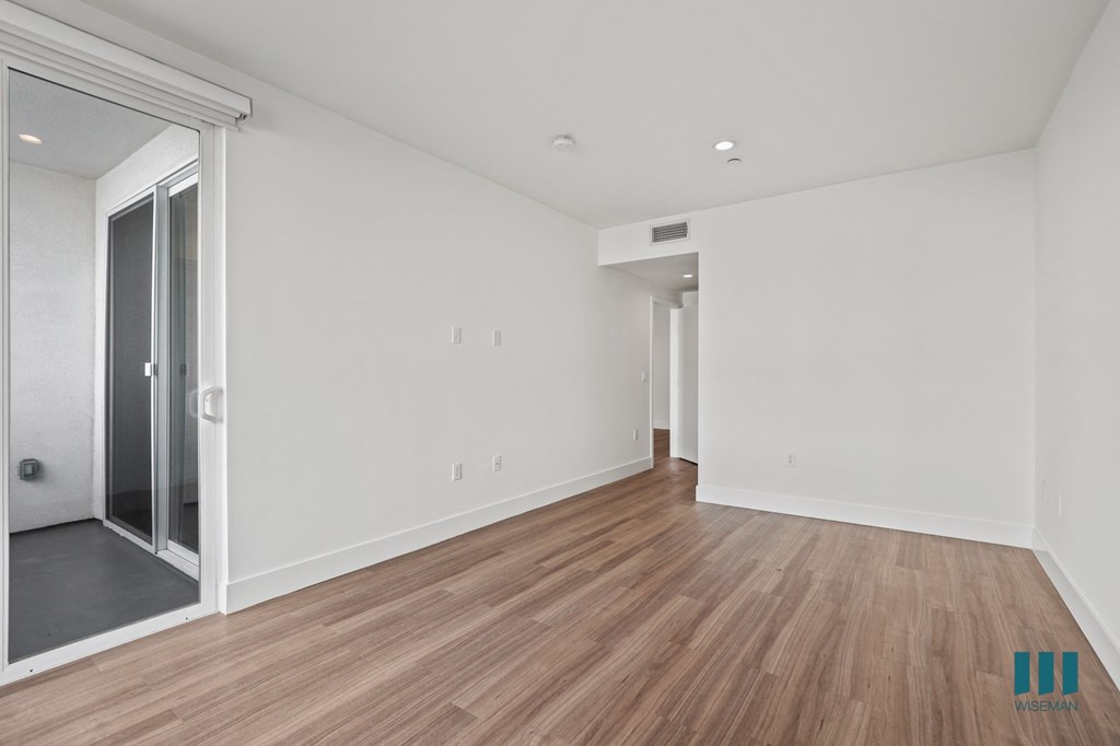 Bedroom with REecessed Lighting, Vinyl Flooring, and Patio