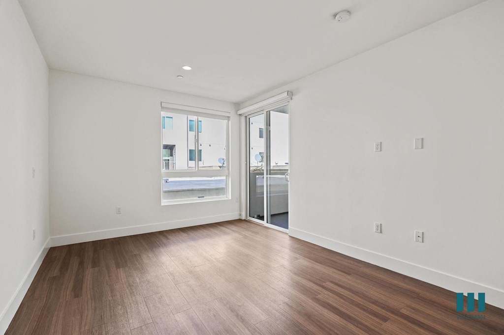 Living Room with Vinyl Flooring, Recessed Lighting, Large-Size Windows,and Patio