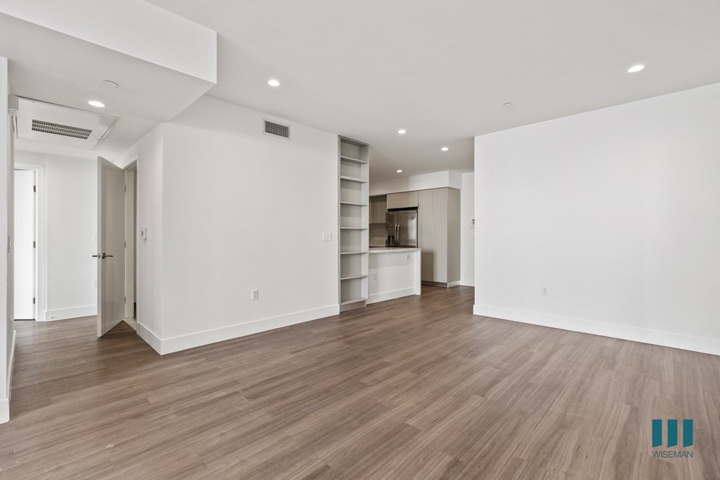 Dining Room Area with Built-In Shelving, Vinyl Flooring, and Recessed Lighting