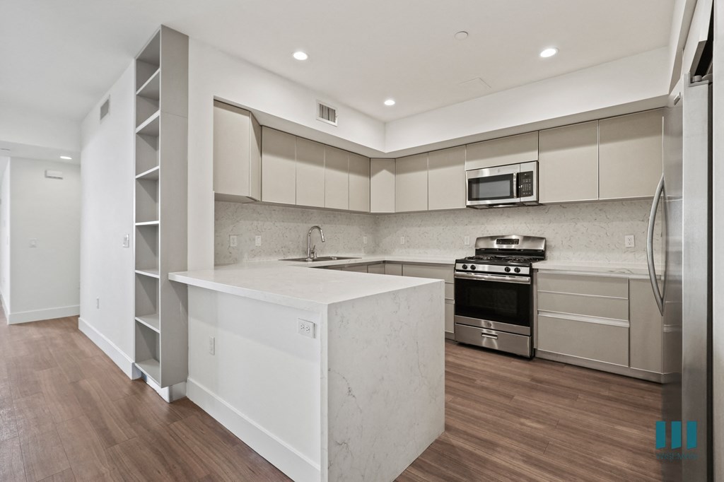 Open-Concept Kitchen with Energy-Efficient Appliances and Ample Cabinet Storage