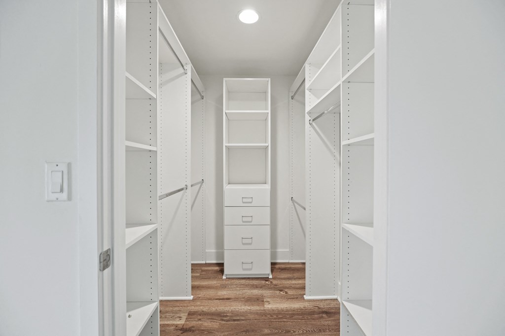 a walk in closet in a 555 waverly unit