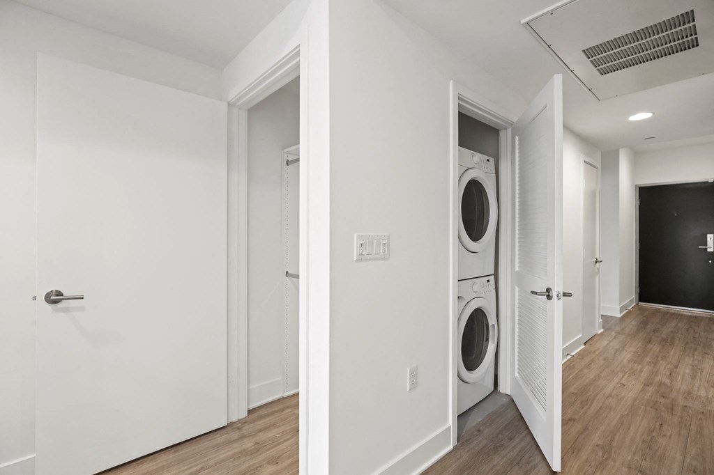 a room with a washer and dryer in it