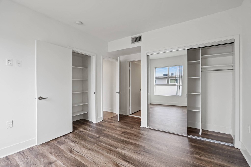 Bedroom with Two Closets with Shelves