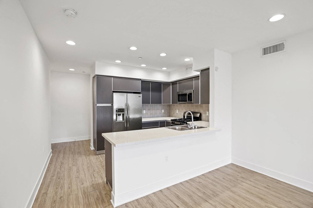 Kitchen with Energy-Efficient Appliances and Countertop Bar