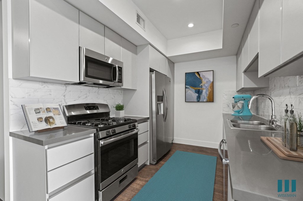 Kitchen with Stainless Refrigerator, Stove, Microwave Oven, and Dishwasher