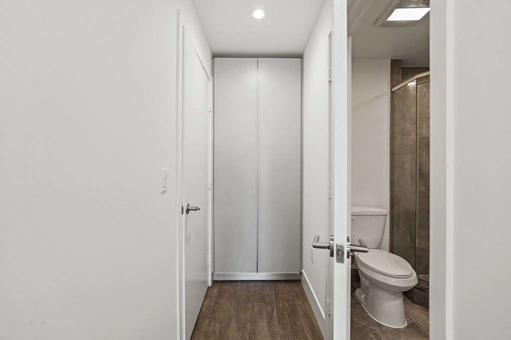 Bedroom with Bathroom and Built-In Cabinet Storage