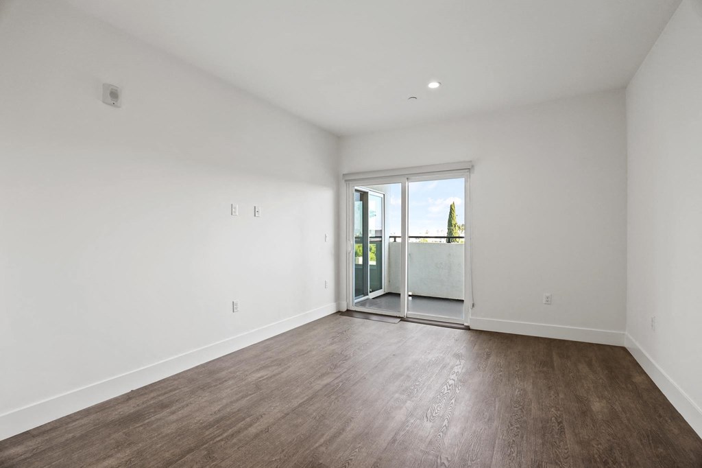 Bedroom with Patio Access, Vinyl Flooring, and Recessed Lighting