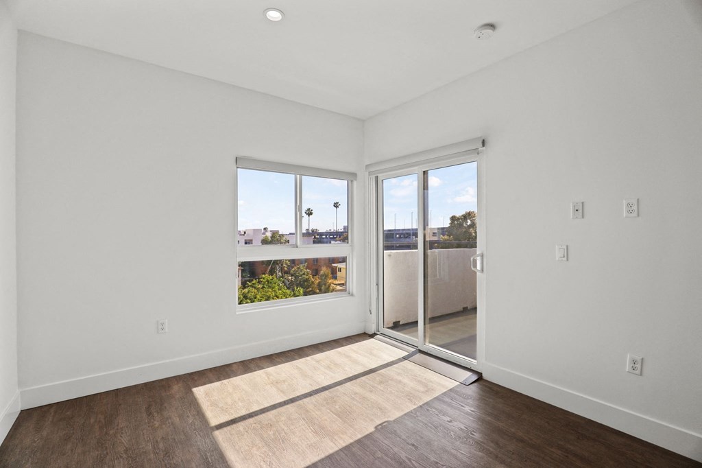Living Room with Recessed Lighting, Vinyl Flooring, and Patio