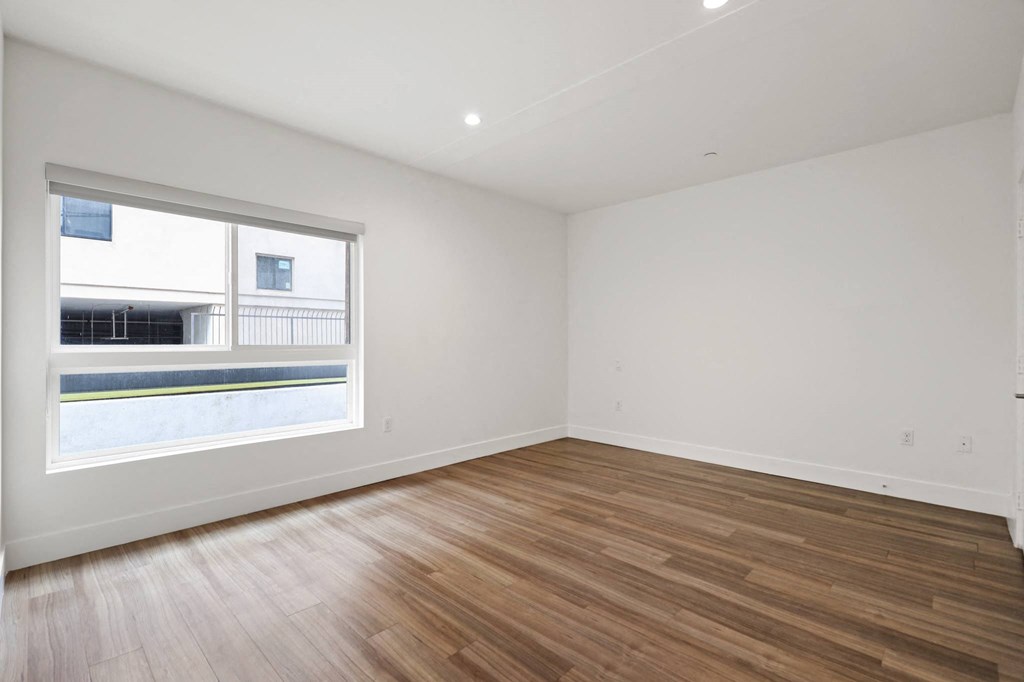 Bedroom with Recessed Lighting, Vinyl Flooring, and Large-Size Windows