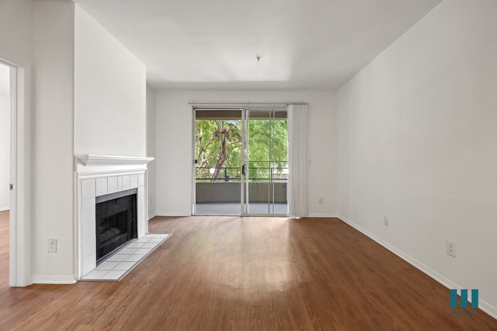 Living Room with Electric Fireplace, Vinyl Flooring, and Patio