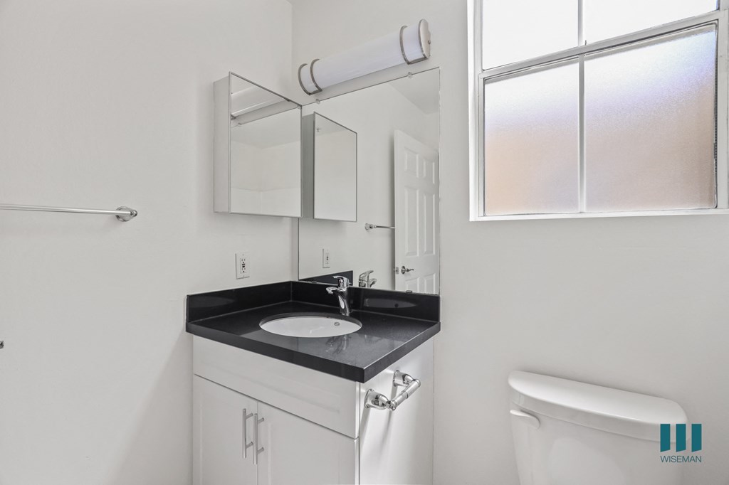 Bathroom with Windows and Vanity Cabinet Storage