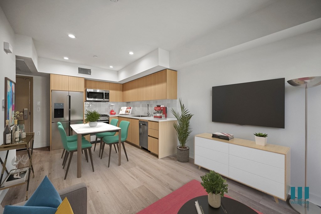 A modern kitchen with a dining table and chairs.